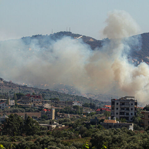 Smoke billows from a site targeted by the Israeli military in the southern Lebanese border village of Kafr Kila, amid ongoing cross-border clashes between Israeli troops and Hezbollah fighters, July 29, 2024.