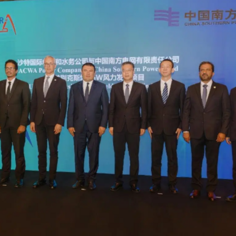 ACWA Power and China Southern Power Grid representatives.