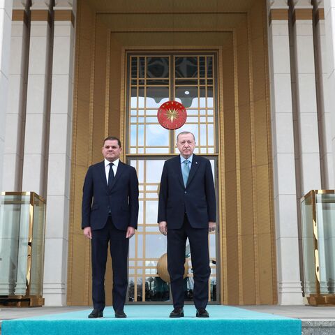 Turkish President Recep Tayyip Erdogan (R) and Libyan government of national unity prime minister Abdul Hamid Dbeibah (L) pose for a photo during the official ceremony prior to their meeting in Ankara on April 12, 2021. (Photo by Adem ALTAN / AFP) (Photo by ADEM ALTAN/AFP via Getty Images)