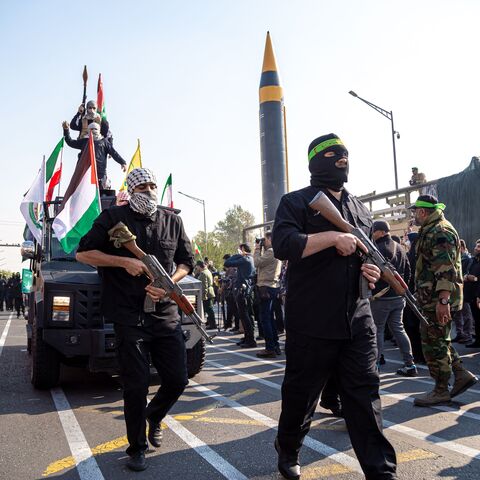 11/24/2023 Tehran, Iran. Members of the Islamic Revolutionary Guard Corps (IRGC) are wearing Palestinian scarves and carrying handheld anti-tank grenade launchers as they participate in the Ela Beit Al-Moghaddas (Al-Aqsa Mosque) military rally in Tehran, Iran. (Photo by Hossein Beris / Middle East Images / Middle East Images via AFP) (Photo by HOSSEIN BERIS/Middle East Images/AFP via Getty Images)