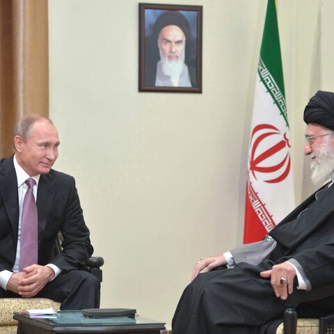 Russian President Vladimir Putin (L) meets with Iran's supreme leader Ayatollah Ali Khamenei in Tehran on November 23, 2015. Putin arrived in Tehran for talks with Khamenei and President Hassan Rouhani, with the Syrian conflict expected to be high on the agenda. The one-day visit will also see Putin take part in a summit of gas exporting countries. AFP PHOTO / SPUTNIK / ALEXEI DRUZHININ (Photo by ALEXEI DRUZHININ / SPUTNIK / AFP) (Photo by ALEXEI DRUZHININ/SPUTNIK/AFP via Getty Images)