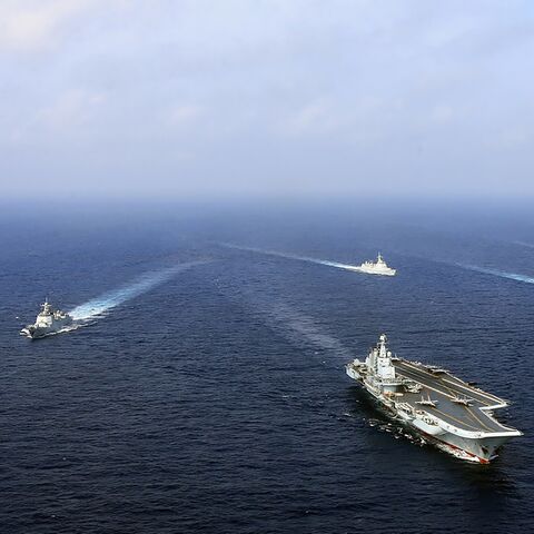 This undated photo taken in April 2018 shows China's sole operational aircraft carrier, the Liaoning (front), sailing with other ships during a drill at sea.