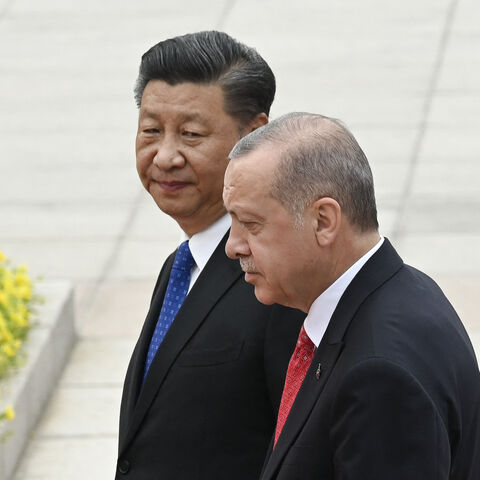 Turkish President Recep Tayyip Erdogan (R) and Chinese President Xi Jinping (L) inspect Chinese honour guards during a welcome ceremony outside the Great Hall of the People in Beijing on July 2, 2019. (Photo by WANG ZHAO / AFP) (Photo by WANG ZHAO/AFP via Getty Images)