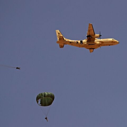 Paratroopers jump off an Egyptian C-130 Hercules military plane during the "Guardians of the Nile" joint military drill between Egypt and Sudan in the Um Sayyala area, northwest of Khartoum, on May 31, 2021. 