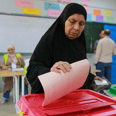 An elderly Jordanian woman votes in parliamentary elections at a polling station at the al-Baqaa Palestinian refugee camp near the capital Amman on September 10, 2024.