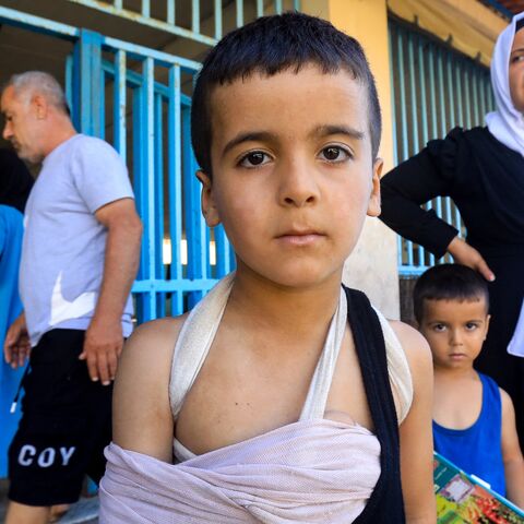 An injured child and others at a school in Beirut housing displaced people who fled Israeli strikes in southern Lebanon, Sep. 26, 2024.