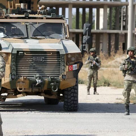 Turkish soldiers patrol the northern Syrian town of Tal Abyad on the border between Syria and Turkey on Oct. 23, 2019. 