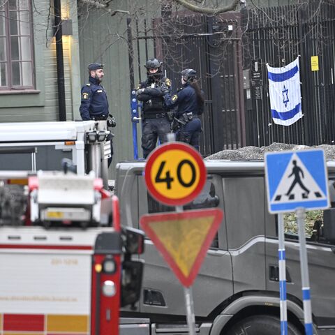 Police officers are seen outside the Israeli embassy in Stockholm, Jan. 31, 2024. 