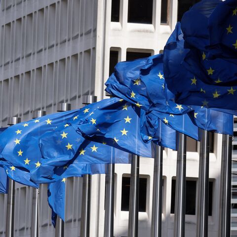 European Union flags fly outside the European Commission building in Brussels on April 12, 2024. 