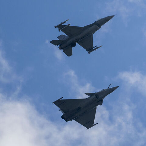 A Dassault Rafale C (below) and an F-16 Fighting Falcon combat airplane perform maneuvers over Ramstein Air Base during a day of fighter plane exercises on June 06, 2024 in Ramstein-Miesenbach, Germany. 