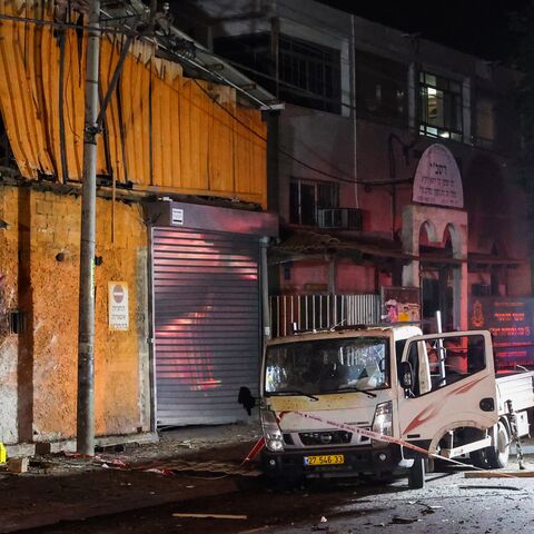 Israeli security and emergency personnel cordon off the site of an explosion in Tel Aviv, on Aug. 18, 2024.