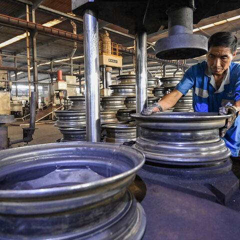 An employee works on a steel wheel production line at a factory in Qingzhou, in eastern China's Shandong province on Sept. 27, 2024. 