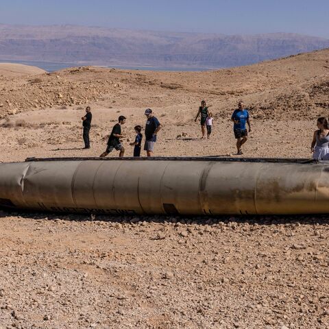 People visit the site of the remains of an Iranian missile in the Negev desert near Arad, Oct. 3, 2024.