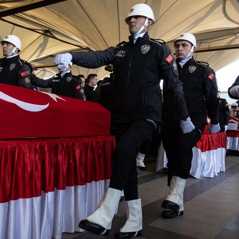 Members of the police carry the coffins of victims of the attack that occurred on Oct. 23, 2024, at the Turkish Aviation Company facility, during a funeral ceremony on Oct. 24, 2024, in Ankara, Turkey.