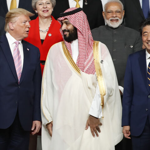 US President Donald Trump (L) speaks with Saudi Arabia's Crown Prince Mohammed bin Salman (C) as Japanese Prime Minister Shinzo Abe (R), Indian Prime Minister Narendra Modi (2nd R) and Britain's Prime Minister Theresa May smile during a family photo session at the G20 Summit in Osaka on June 28, 2019. (Photo by KIM KYUNG-HOON / POOL / AFP) (Photo credit should read KIM KYUNG-HOON/AFP via Getty Images)