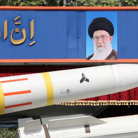 An Iranian military truck carries parts of a Sayad 4-B missile past a portrait of Iran's supreme leader, Ayatollah Ali Khamenei, during a military parade as part of a ceremony marking the country's annual army day, Tehran, April 17, 2024.