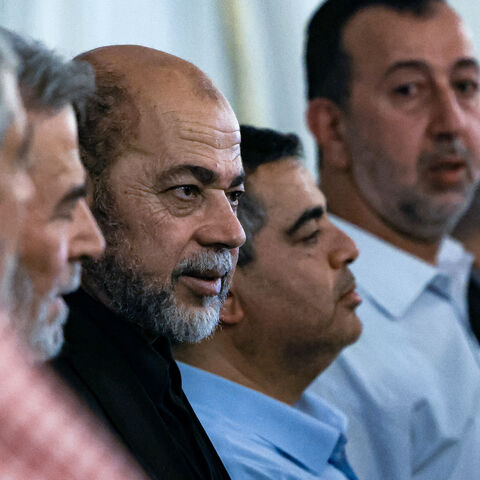 Mourners offer their condolences to senior member of Hamas' political bureau Musa Abu Marzuk (C) during the funeral of the slain Hamas political leader Ismail Haniyeh, in Doha on August 2, 2024. 