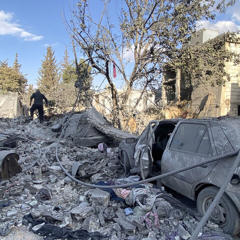 People check the destruction at the site of an Israeli airstrike that targeted the eastern village of Bazzaliyeh in the Hermel district of Lebanon's Bekaa Valley, near the border with Syria, Nov. 1, 2024.