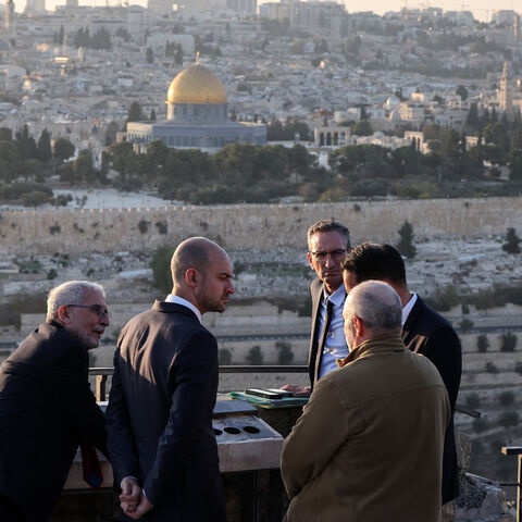 France's Minister for Europe and Foreign Affairs Jean-Noel Barrot (2-R) speaks to members of his delegation as he visits the Mount of Olives, overlooking Jerusalem's Old City and Al-Aqsa Mosque compound, Nov. 7, 2024.