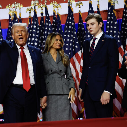 WEST PALM BEACH, FLORIDA - NOVEMBER 06: Republican presidential nominee, former U.S. President Donald Trump waves to supporters with former first lady Melania Trump and Barron Trump during an election night event at the Palm Beach Convention Center on November 06, 2024 in West Palm Beach, Florida. Americans cast their ballots today in the presidential race between Republican nominee former President Donald Trump and Vice President Kamala Harris, as well as multiple state elections that will determine the ba