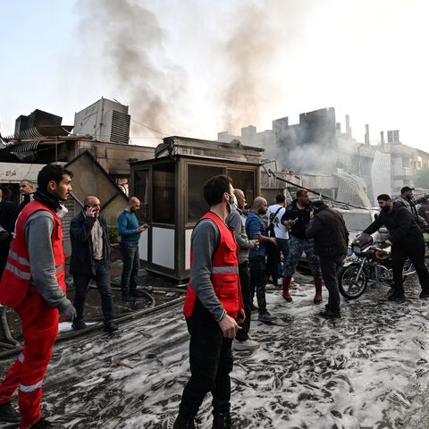 People check the damage following a reported Israeli strike in the Mazzeh district of Damascus, on Nov. 14, 2024.