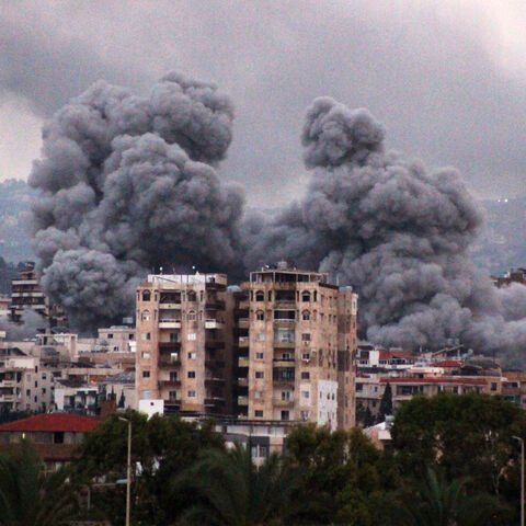 A photo taken from the southern Lebanese coastal city of Tyre shows smoke billowing following an Israeli airstrike which targeted the area of al-Hosh on the outskirts of Tyre, on November 19, 2024. (Photo by KAWNAT HAJU / AFP) (Photo by KAWNAT HAJU/AFP via Getty Images)