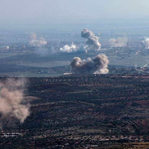 Smoke billows from the site of clashes and mutual shelling between Syrian jihadists and allied factions and regime forces on the front lines on the outskirts of the city of Saraqib, in Aleppo province, on Nov. 28, 2024.