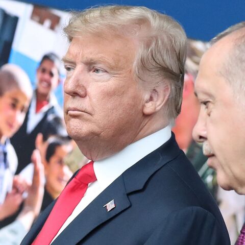 US President Donald Trump (L) talks with Turkish President Recep Tayyip Erdogan (R) at NATO headquarters in Brussels during a NATO summit, July 11, 2018.