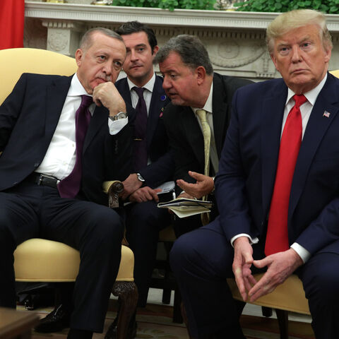 WASHINGTON, DC - NOVEMBER 13: Turkish President Recep Tayyip Erdogan listens to translation as he meets with U.S. President Donald Trump and five Republican U.S. senators in the Oval Office of the White House on November 13, 2019 in Washington, DC. During their meeting, Trump and Erdogan were scheduled to discuss Turkey's purchase of a Russian air defense system as well as the Turkish offensive against the Kurds in Syria. Also in DC today, the first public impeachment hearings took place in the House Intell