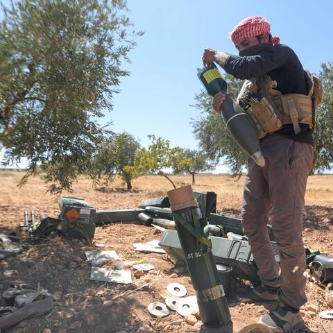 A fighter prepares mortar ammunition as Turkish-supported forces deploy on the Buwayhij-Boughaz-Korhoyuk frontline on the outskirts of Manbij in northeastern Syria, as they fight with the Kurdish-led Syrian Democratic Forces (SDF) on Sept. 6, 2023. 