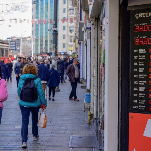 This picture taken on March 21, 2024 on Istiklal avenue, Istanbul, shows foreign exchange rates displayed against the Turkish lira. Turkey's central bank raised it's key interest rate on March 21, 2024, resuming a tightening cycle in a bid to tame rising consumer prices, one month after having held rates. In a statement the bank said that the monetary policy committee "has decided to raise the policy rate from 45 percent to 50 percent". (Photo by Yasin AKGUL / AFP) (Photo by YASIN AKGUL/AFP via Getty Images