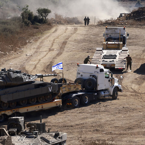 An Israeli tank is transported to a position in the Upper Galilee region of northern Israel near the border with Lebanon, Sept. 29, 2024.