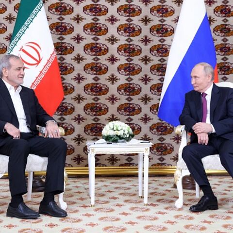 In this pool photograph distributed by the Russian state agency Sputnik, Russia's President Vladimir Putin meets with Iran's President Masoud Pezeshkian on the sidelines of an international forum "Interrelation of times and civilizations - basis of peace and development" dedicated to the 300th anniversary of poet Magtymguly Fragi's birthday in Ashgabat on October 11, 2024. (Photo by Alexander SHCHERBAK / POOL / AFP) (Photo by ALEXANDER SHCHERBAK/POOL/AFP via Getty Images)