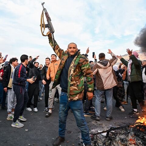 People celebrate the overthrow of President Bashar al-Assad and Baath Party rule, Umayyad Square, Damascus, Dec. 8, 2024.