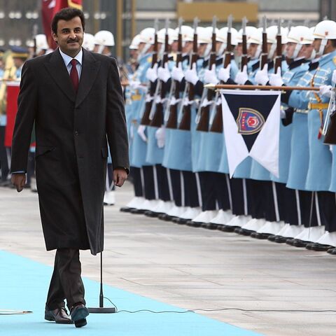 Qatari Crown Prince Sheikh Tamim bin Hamad bin Khalifa Al Thani (2ndL) and Turkish President Recep Tayyip Erdogan (L) 