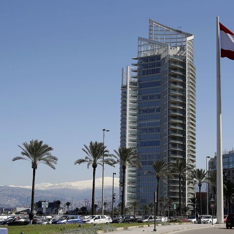 A picture shows the four seasons hotel in Beirut with the snow covered mountain of Sannine in the background on March 8, 2019. (Photo by JOSEPH EID / AFP) (Photo credit should read JOSEPH EID/AFP via Getty Images)