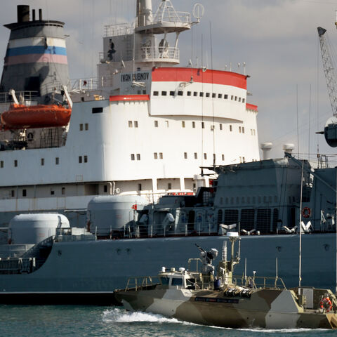 A Russian ship is pictured in front of fleet replenishment oiler Ivan Bubnov (L) at the Russian naval base in the port of Tartus, Syria, Sept. 26, 2019.