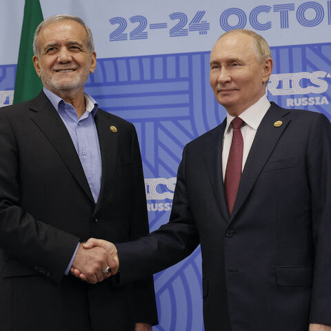 Russian President Vladimir Putin meets with Iranian President Masoud Pezeshkian on the sidelines of the BRICS summit in Kazan on Oct. 23, 2024. 