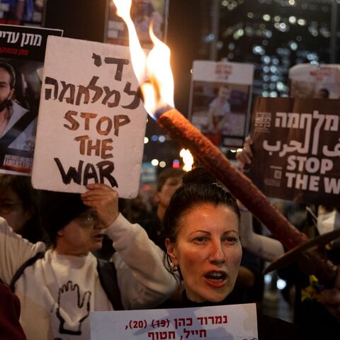 Protesters calling for the return of hostages held in the Gaza Strip react after a Gaza ceasefire and hostage release deal was reached on January 15, 2025 in Tel Aviv, Israel.