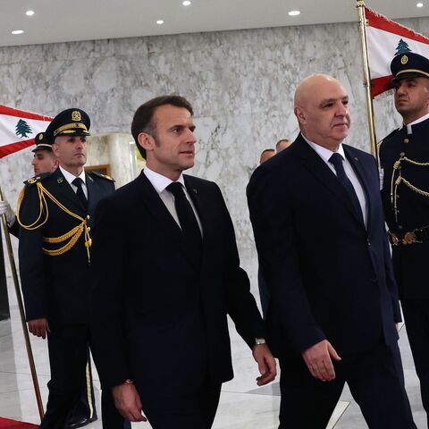 France's President Emmanuel Macron (L) is welcomed by Lebanon's new president, Joseph Aoun, at the presidential palace in Baabda, Beirut, Jan. 17, 2025.