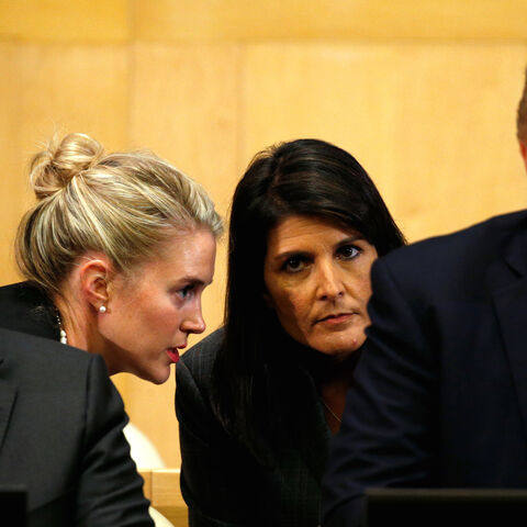 U.S. Ambassador to the UN Nikki Haley (2nd R) receives information, as U.S. President Donald Trump and UN Secretary General Antonio Guterres participate in a session on reforming the United Nations at UN Headquarters in New York, U.S., September 18, 2017. REUTERS/Kevin Lamarque - RC12FAAB1990