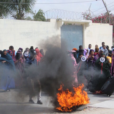 Women take part in a demonstration against the Somali President Mohamed Abdulahi Farmajo in Mogadishu on December 15, 2020 accused of interferences in the electoral process. (Photo by STRINGER / AFP) / The erroneous mention appearing in the metadata of this photo by STRINGER has been modified in AFP systems in the following manner: [a demonstration against the Somali President Mohamed Abdulahi Farmajo] instead of [a demonstration against the Somali Prime Minister]. Please immediately remove the erroneous me