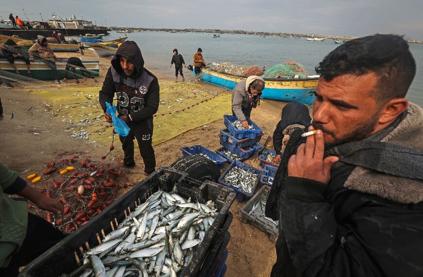 Palestinian fishermen on a beach in Gaza City on January 29, 2022