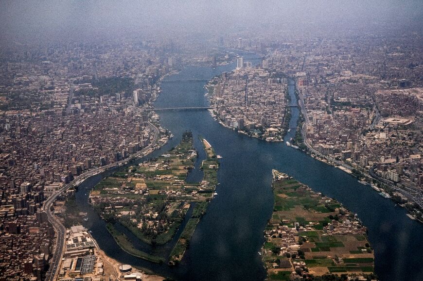 Egypt's capital Cairo and, to the left of the Nile, its twin city of Giza