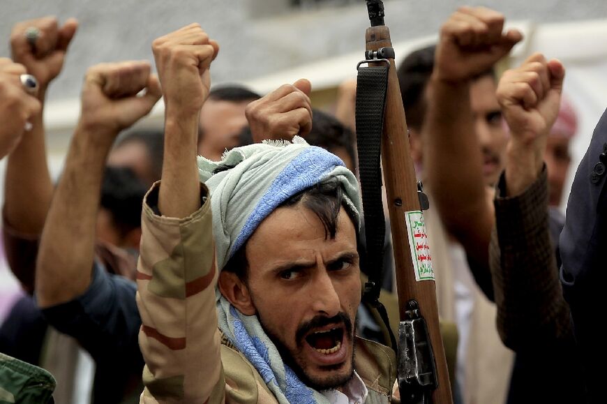 In this file photo taken on June 19, 2019 Yemenis demonstrate against the suspension of aid provided by the World Food Programme in front of United Nations' office in the capital Sanaa