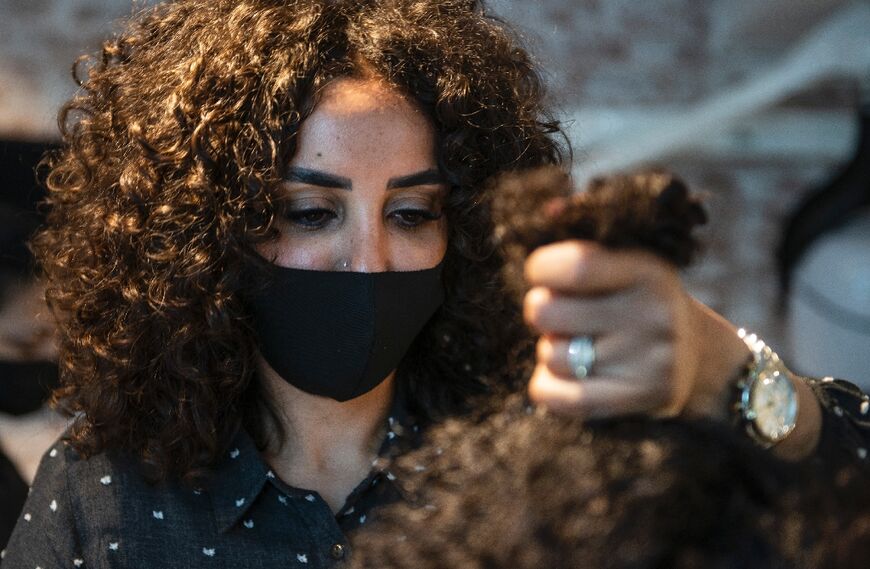 Sara Safwat, an owner of the "Curly Studio", says the obsession with straight hair is rooted in "completely false beauty ideals"