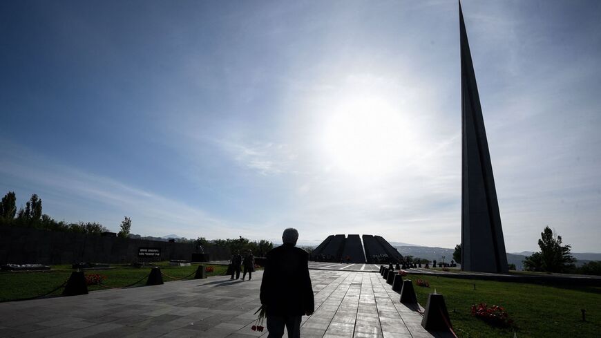 A man walks toward the Tsitsernakaberd Memorial in Yerevan on April 24, 2021 as Armenia marks the 106th anniversary of World War I-era mass killings. (Photo by KAREN MINASYAN/AFP via Getty Images)