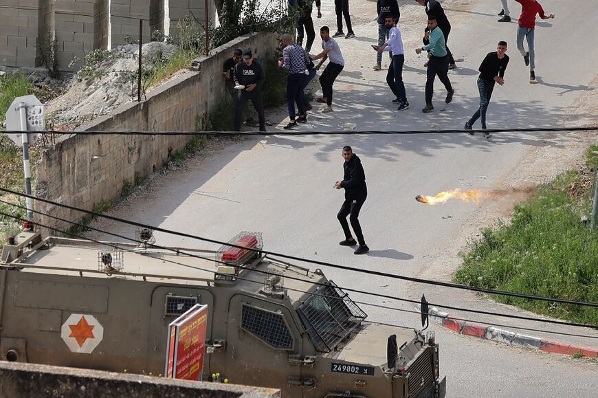 Palestinians confront Israeli troops during clashes in the Jenin refugee camp in the occupied West Bank