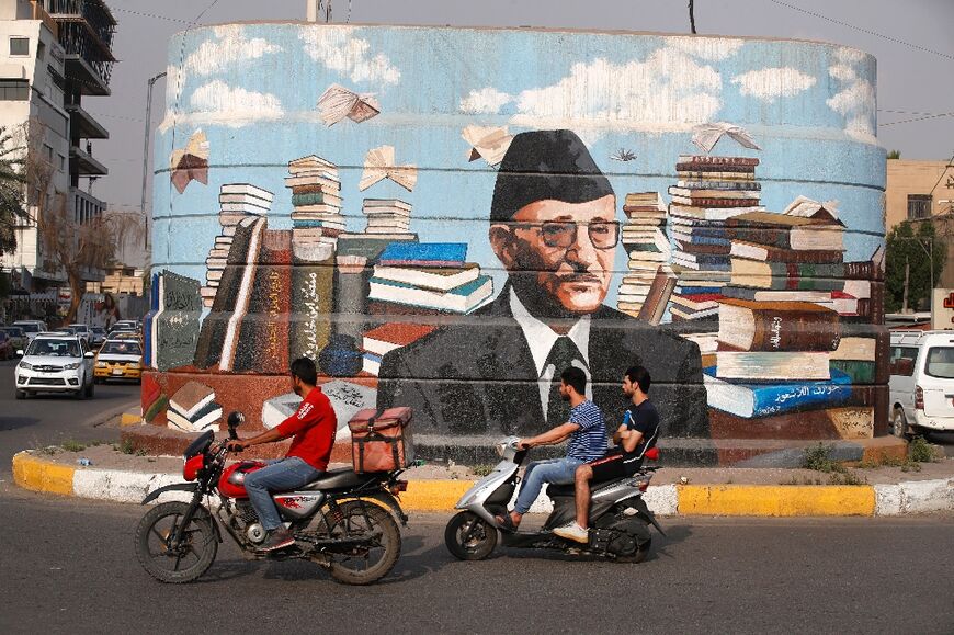 Iraqis are delighted by the transformation brought about by the murals, such as this one of Iraqi author Ali al-Wardi