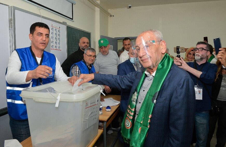 A handout picture provided by the Lebanese Parliament on May 15, 2022 shows Speaker Nabih Berri casting his vote for parliamentary elections at a polling station in the southern village of Tebnin